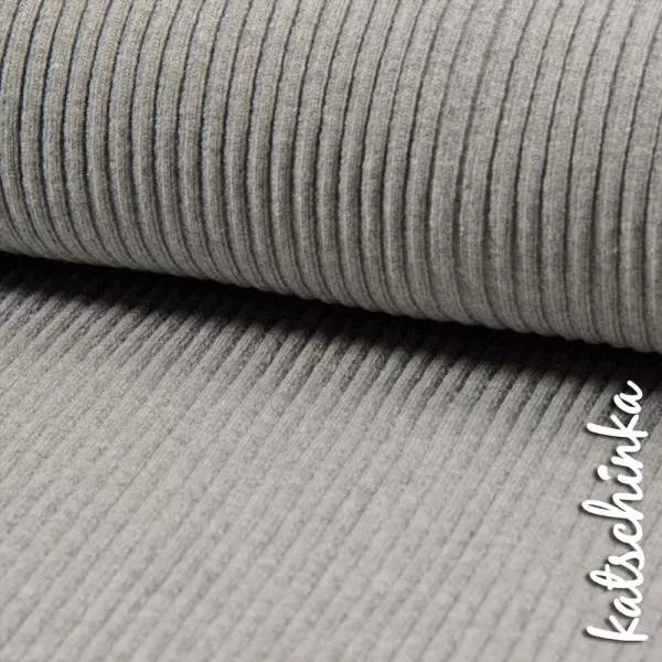 Detailaufnahme schwarzes Grobstrick Bündchen mit elastischer, gerippter Struktur