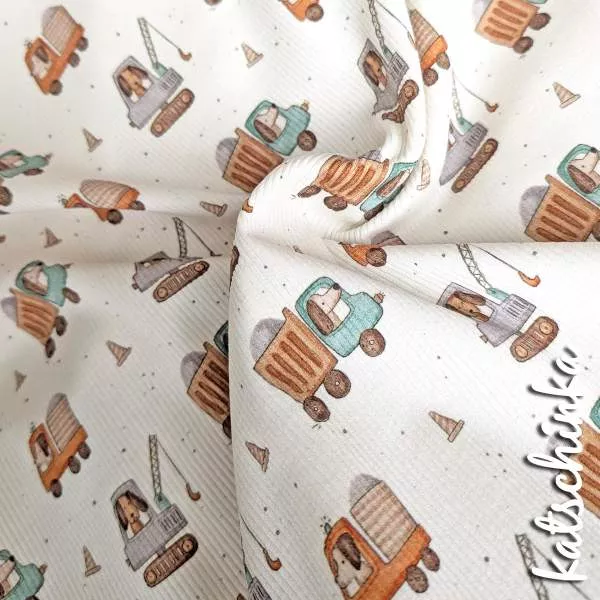 Rippenjersey mit Motiv auf hellem Hintergrund – weicher Ribjersey Kinderstoff mit Polizeiautos als Detailaufnahme