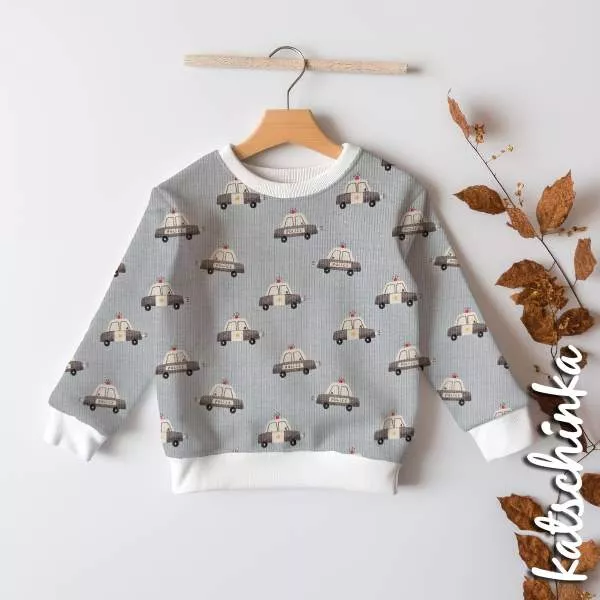 Kinderpullover aus Rippenjersey mit Polizeiwagen Motiv – weicher Ribjersey Stoff für Kinderkleidung in hellblau